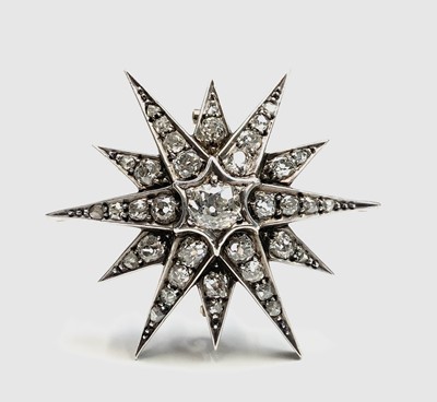 Lot 303 - A Victorian diamond set star brooch, the...