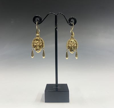 Lot 573 - A pair of high purity gold tribal mask...