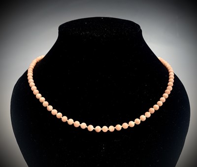 Lot 459 - A pale pink coral bead necklace with 9ct gold...