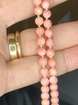 Lot 459 - A pale pink coral bead necklace with 9ct gold...