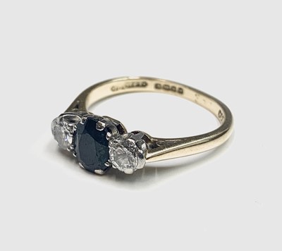 Lot 570 - An 18ct gold sapphire and diamond ring.