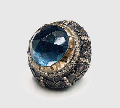 Lot 360 - Massive crown form ring with blue stone