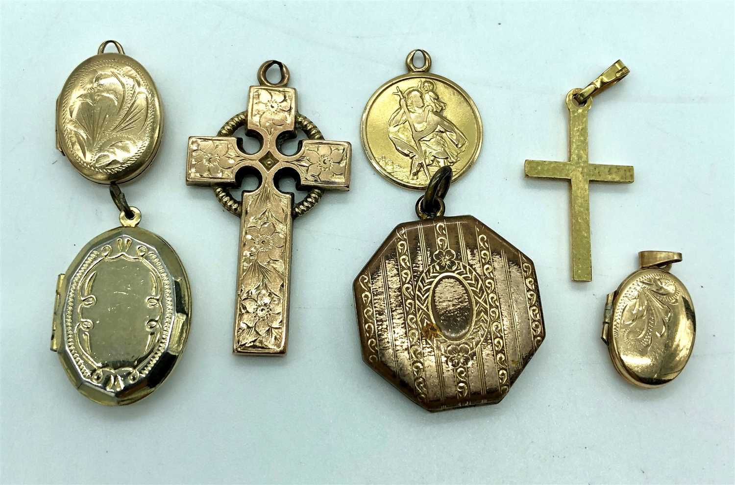 Lot 2454 - Four lockets, two crosses and a gold St.