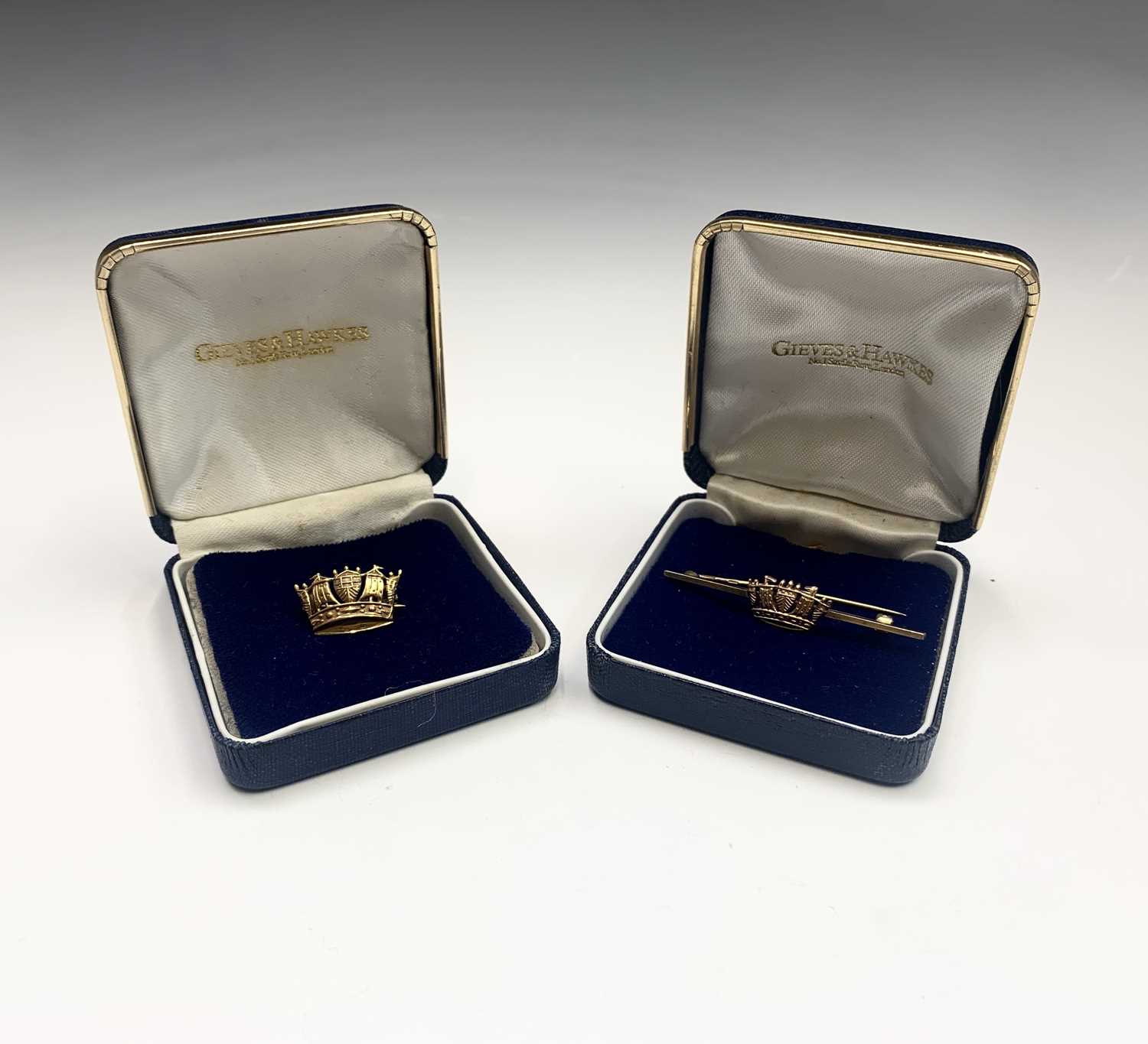 Lot 689 - Two Gieves and Hawkes 9ct gold Naval brooches...