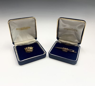 Lot 689 - Two Gieves and Hawkes 9ct gold Naval brooches...