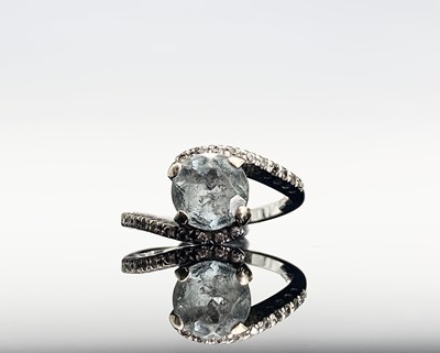 Lot 426 - An 18ct white gold aquamarine and diamond...