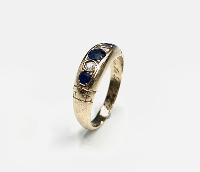 Lot 601 - An 18ct Victorian style ring set two sapphires...