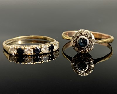 Lot 432 - Two gold rings one set with a sapphire and...