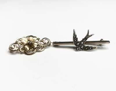 Lot 766 - Two gold brooches one with a pearl set swallow