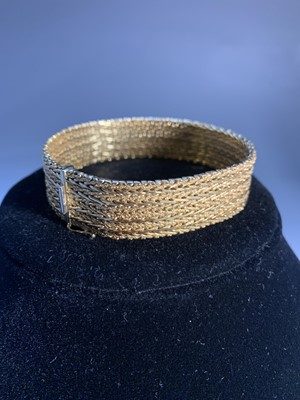 Lot 702 - An Italian woven 18ct gold bracelet by...