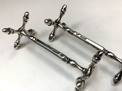 Lot 7 - A pair of silver knife rests by Martin, Hall &...
