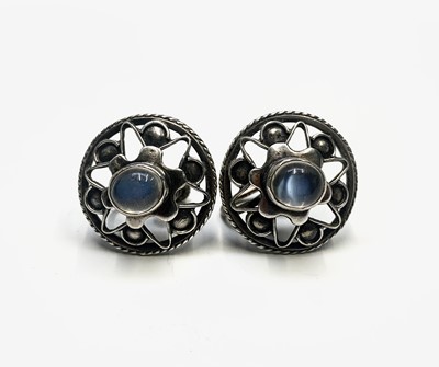 Lot 465 - A pair of silver screw earrings set with...