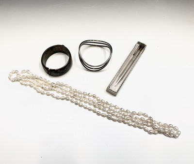 Lot 709 - Two silver bangles90gm a pearl necklace and...