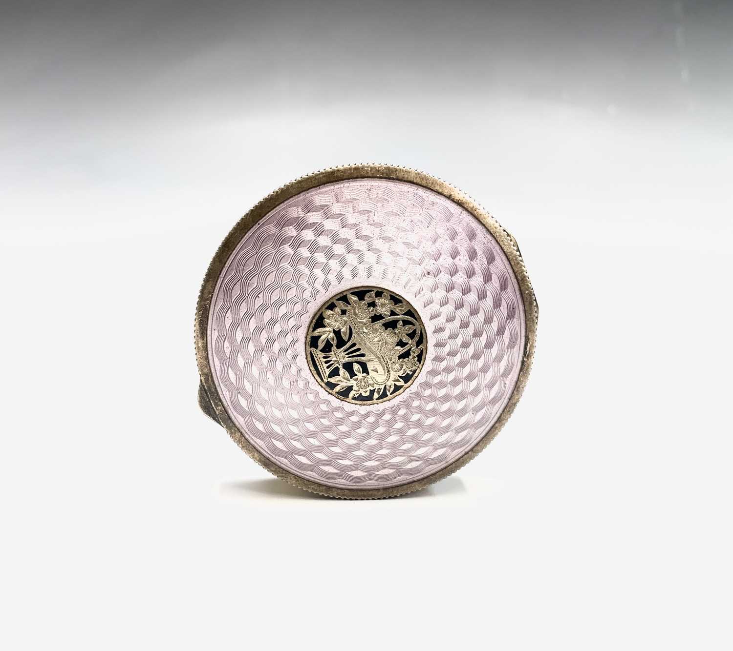 Lot 201 - An enamelled gilt compact
