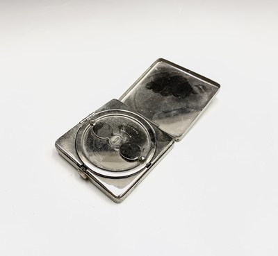 Lot 211 - Two silver-mounted purses, an Art Deco compact...
