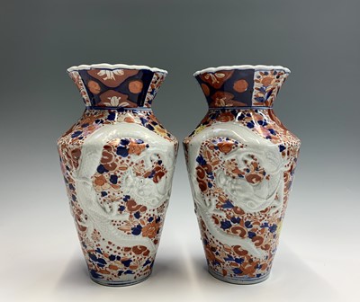 Lot 132 - A pair of Japanese Imari dragon moulded vases,...