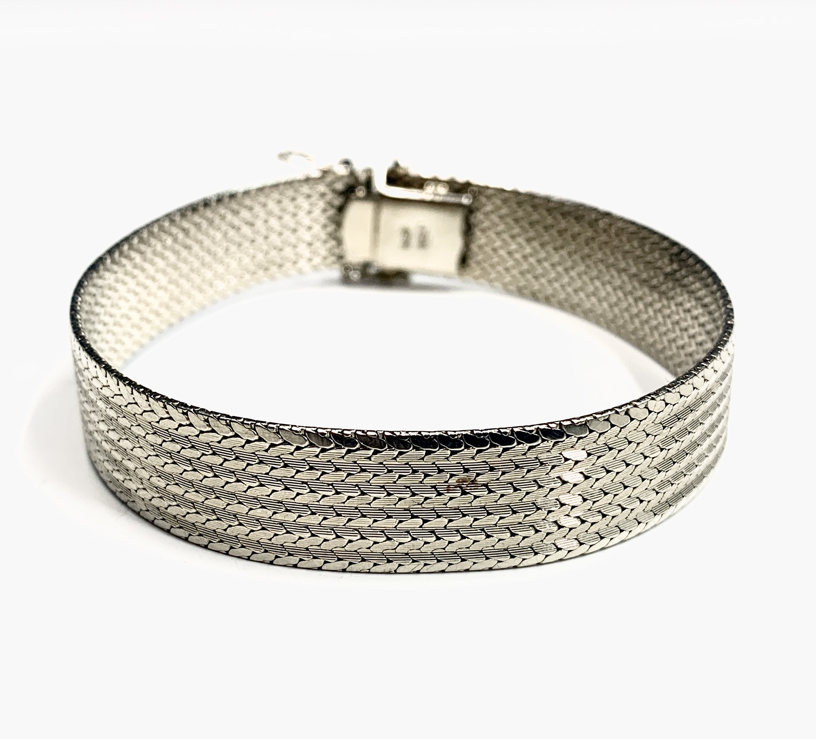 Lot 425 An 18ct white gold woven bracelet 36.8gm