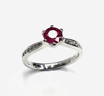 Lot 767 - An 18ct white gold ruby ring with diamond...