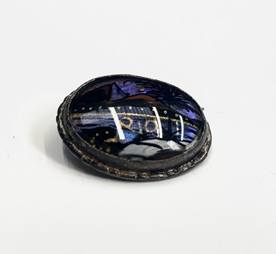 Lot 27 - A chalcedony and enamel silver brooch.