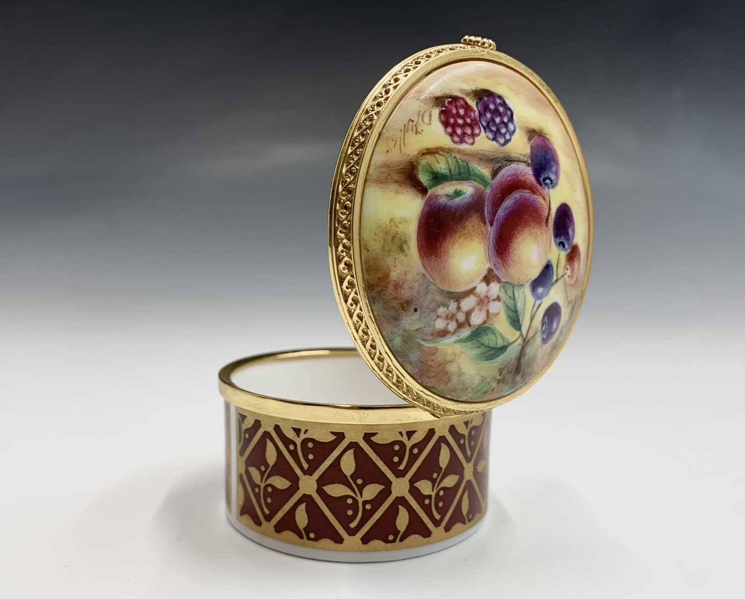 Lot 804 - A Royal Worcester fruit painted trinket box...