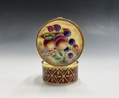 Lot 804 - A Royal Worcester fruit painted trinket box...