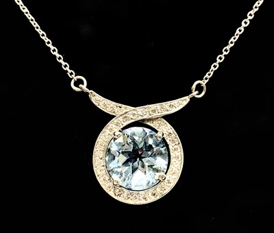 Lot 382 - A stylish platinum pendant with a circular...