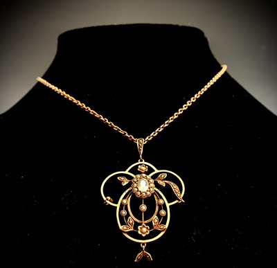 Lot 466 - An art nouveau 9ct gold pendant set with an...