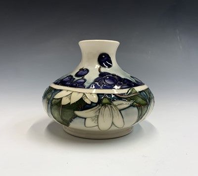 Lot 819 - A Moorcroft 'Juneberry' pattern vase of squat...