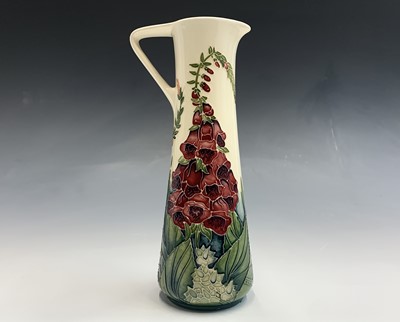 Lot 837 - A Moorcroft 'Amberwood' pattern jug, designed...