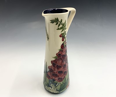 Lot 837 - A Moorcroft 'Amberwood' pattern jug, designed...