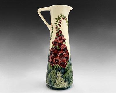 Lot 837 - A Moorcroft 'Amberwood' pattern jug, designed...