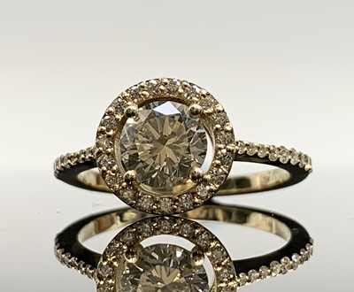 Lot 660 - A certificated diamond halo ring with a 1.02ct...