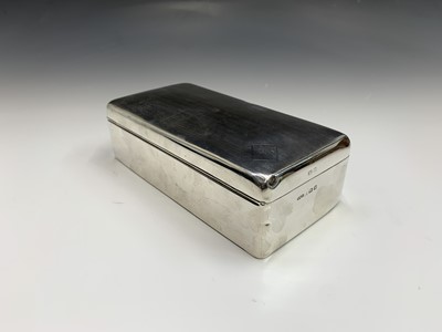 Lot 90 - An engine turned large silver cigarette box by...