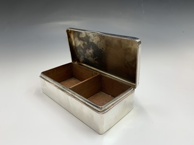 Lot 90 - An engine turned large silver cigarette box by...