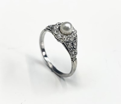 Lot 665 - A refined white gold ring with a pearl and...