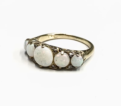 Lot 667 - A Victorian style gold ring set with five...