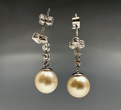 Lot 676 - A pair of choice pearl earrings each is of...