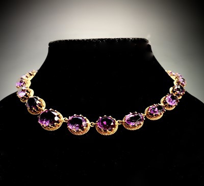 Lot 395 - A graduated amethyst necklace, 44.6g.