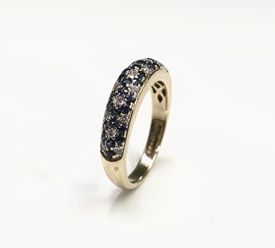 Lot 486 - A stylish 18ct gold ring pave half hoop set...