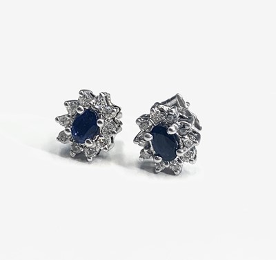 Lot 508 - A pair of diamond and sapphire cluster...