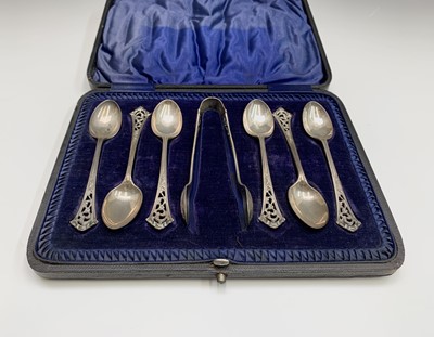 Lot 46 - A set of six pierced and chased teaspoons and...