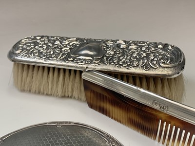 Lot 61 - A pair of silver-mounted brushes, a matching...