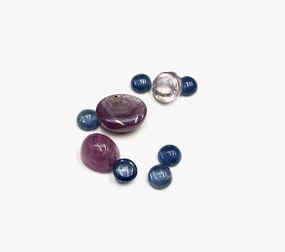 Lot 402 - Various pink and blue sapphire cabochons,...