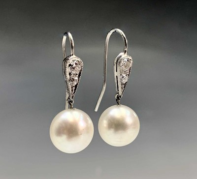 Lot 366 - A pair of 10.3mm pearl drop earrings each...