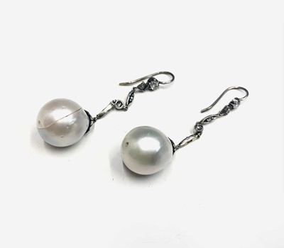 Lot 687 - A pair of elegant pearl and diamond drop...