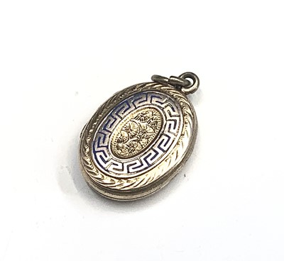 Lot 575 - A chased and enamelled gold locket, 4.1g.