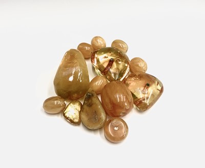 Lot 322 - Various 'amber' beads and pieces, 102g.