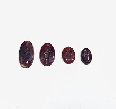 Lot 720 - Four carved agate intaglios, 4.2g.