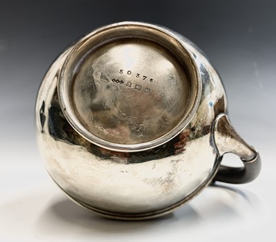 Lot 105 - A Liberty silver hot water jug with globular...