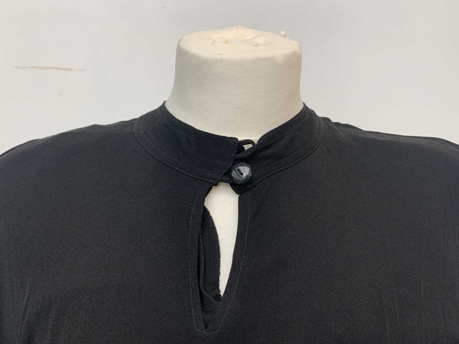 Lot 2818 - A Jean Muir black viscose cape dress, label